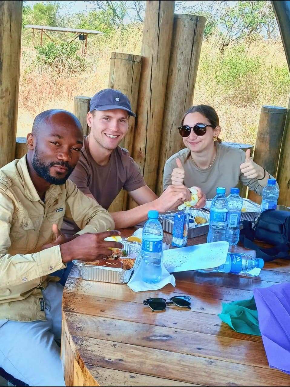 Guide and guests sharing a bush lunch